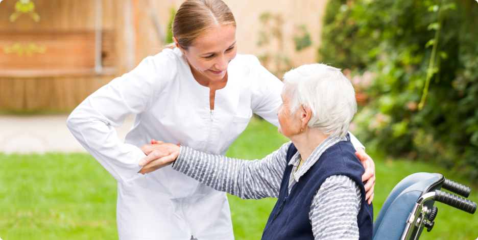 Caregiver helping an Elderly Woman